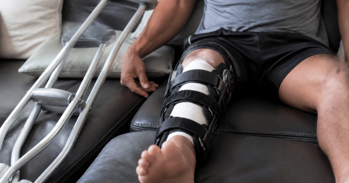 Athlete's leg immobilized with medical support cast.